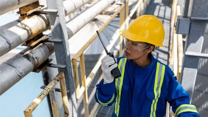 Industrial Worker Using Walkie Talkie